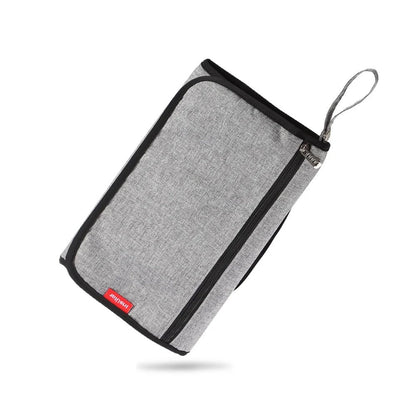 tapis à langer nomade - Mamanplusbebe